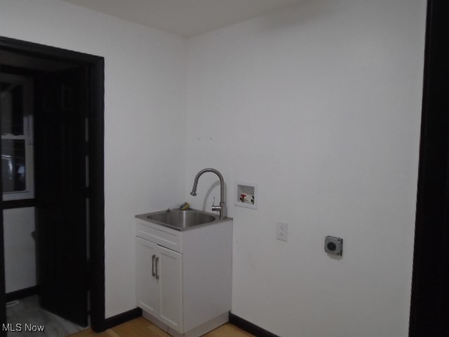 10971 Auburn Road Chardon, OH 44024 - Photo 13 of 40 Washroom with hookup for a washing machine, electric dryer hookup, light wood-style floors, and cabinet space