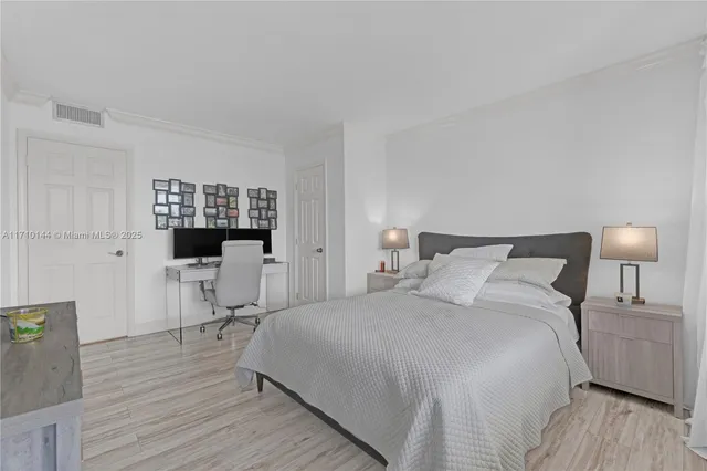 a bedroom with a bed and a table