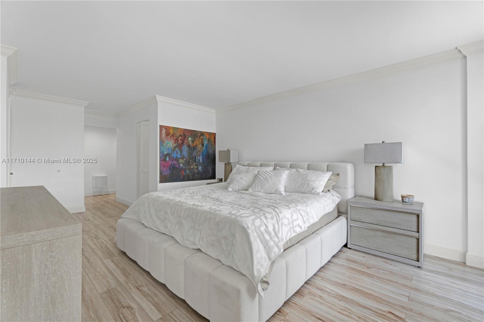 1600 South Ocean Drive, Unit 2F Hollywood, FL 33019 - Photo 15 of 30 a bedroom with a bed and a lamp on table