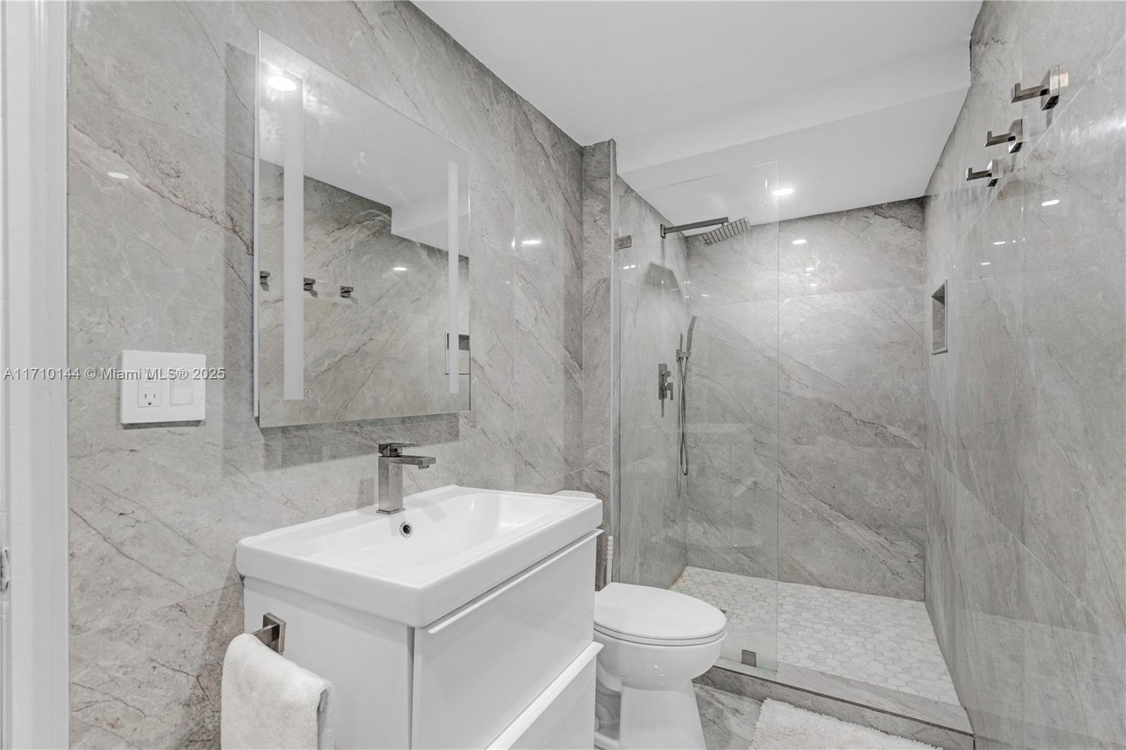 1600 South Ocean Drive, Unit 2F Hollywood, FL 33019 - Photo 19 of 30 a bathroom with a sink toilet and shower