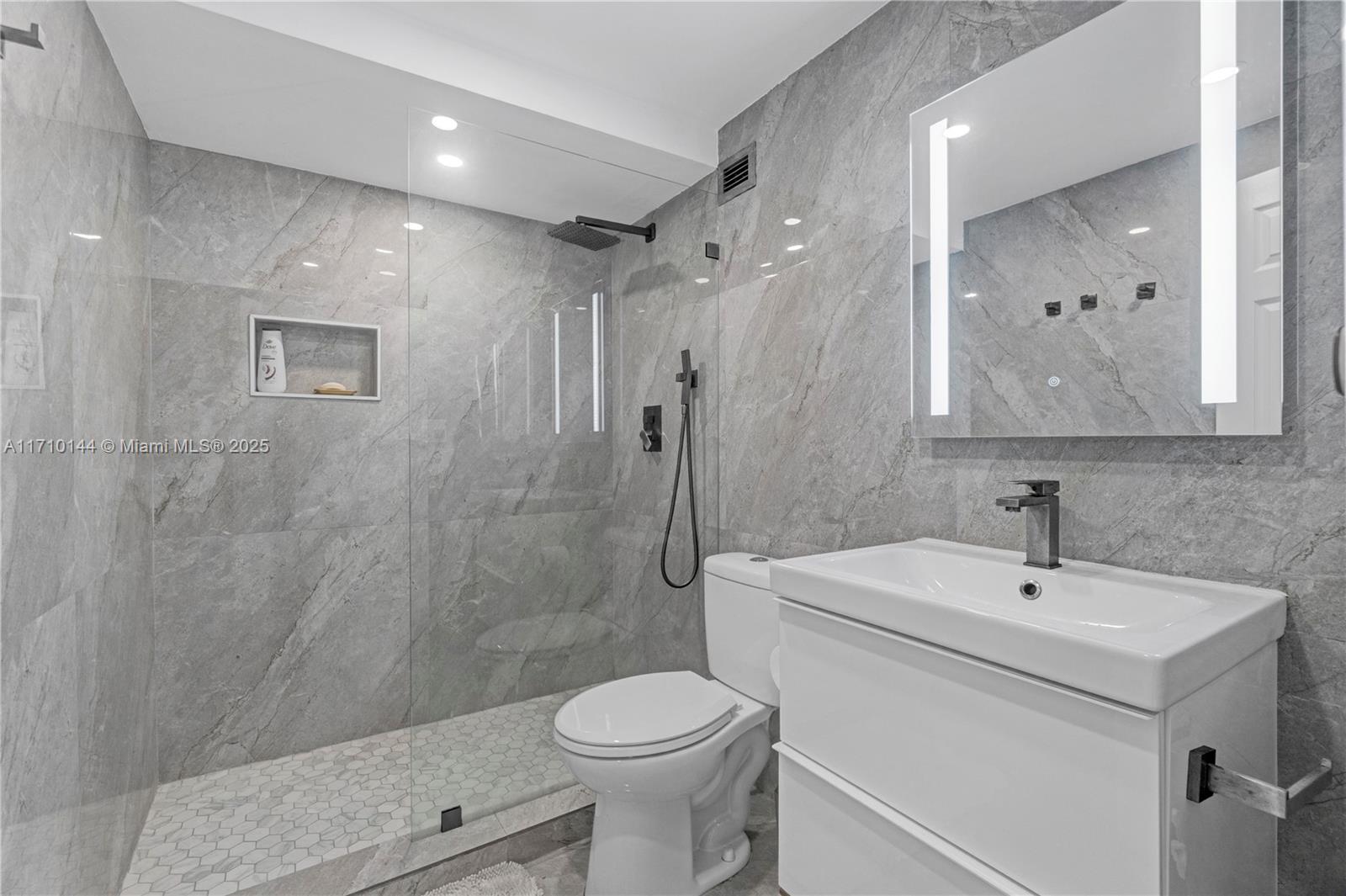 1600 South Ocean Drive, Unit 2F Hollywood, FL 33019 - Photo 21 of 30 a bathroom with a sink toilet and shower