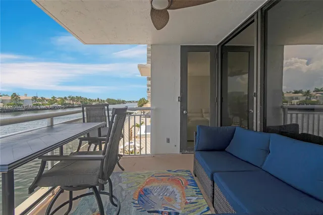 a balcony with furniture and city view
