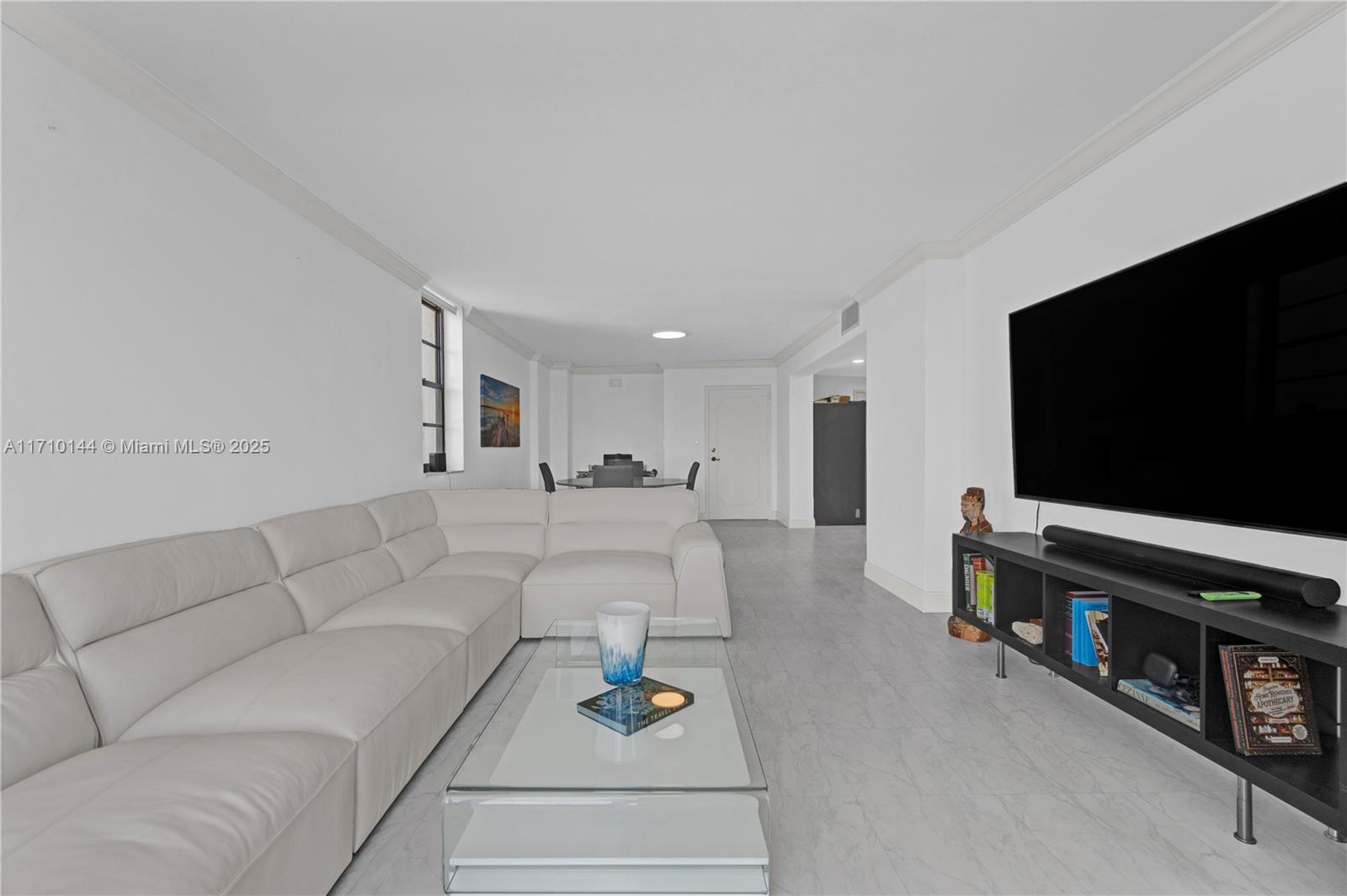 1600 South Ocean Drive, Unit 2F Hollywood, FL 33019 - Photo 5 of 30 a living room with furniture and a flat screen tv