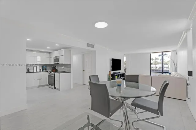 a view of a dining room with furniture and a livingroom