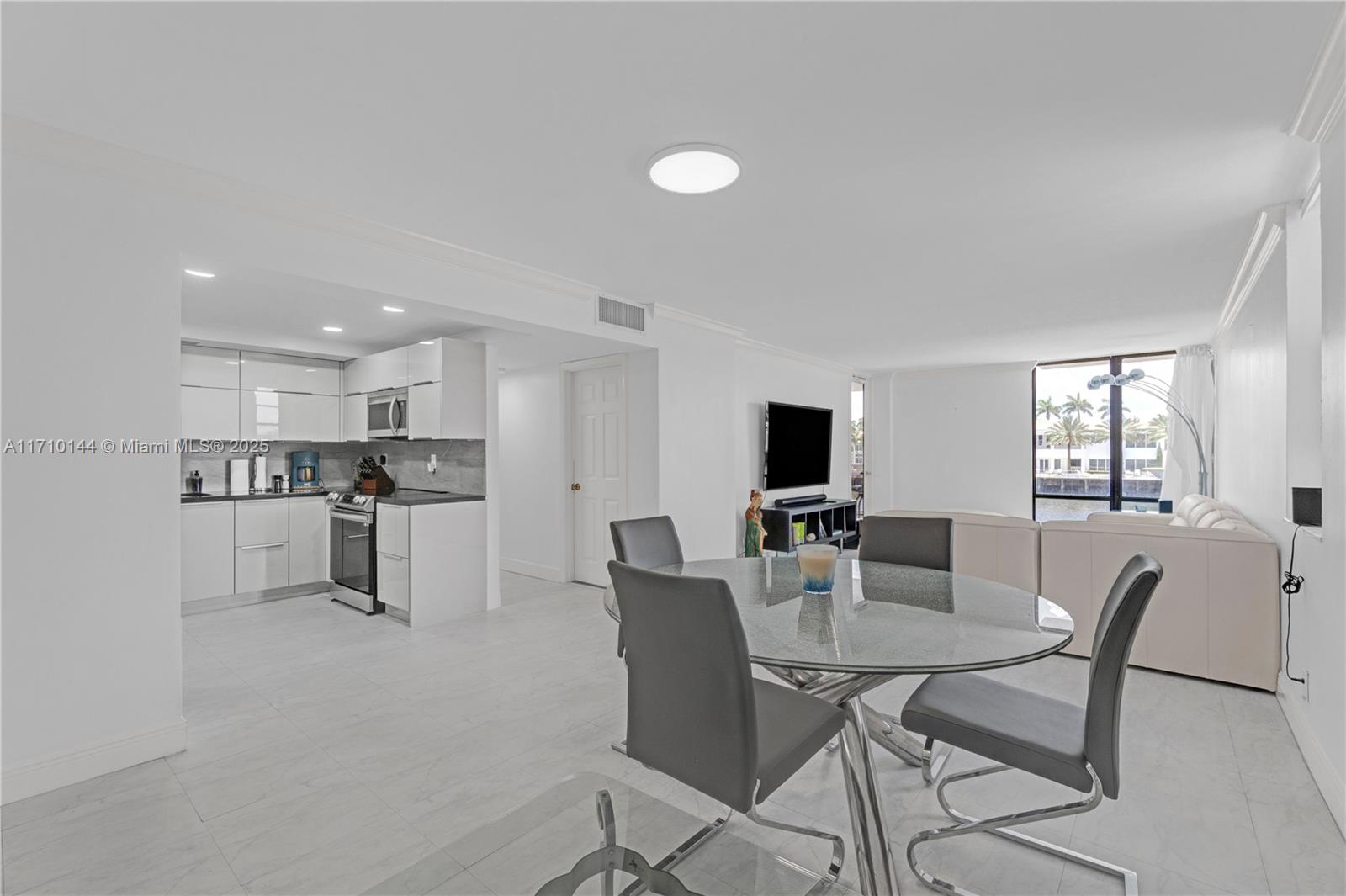 1600 South Ocean Drive, Unit 2F Hollywood, FL 33019 - Photo 7 of 30 a view of a dining room with furniture and a livingroom