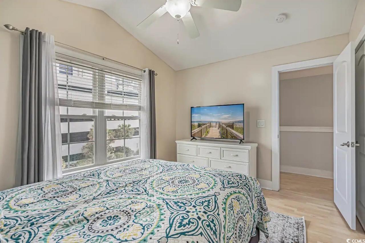 2701 Kashton Street Myrtle Beach, SC 29577 - Photo 15 of 23 Bedroom featuring light wood-type flooring, lofted ceiling, and ceiling fan