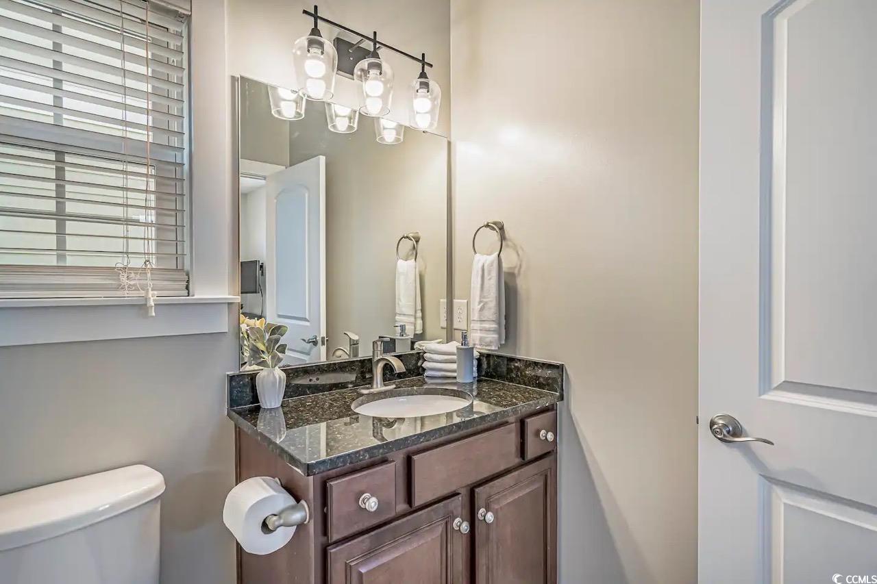 2701 Kashton Street Myrtle Beach, SC 29577 - Photo 16 of 23 Half bathroom with toilet and vanity