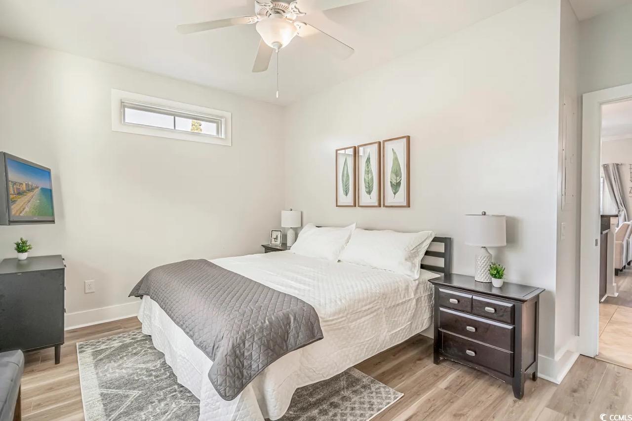 2701 Kashton Street Myrtle Beach, SC 29577 - Photo 17 of 23 Bedroom featuring light wood finished floors and a ceiling fan
