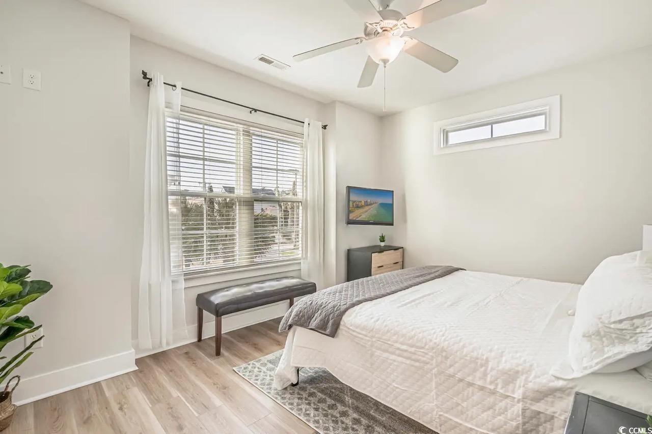 2701 Kashton Street Myrtle Beach, SC 29577 - Photo 18 of 23 Bedroom with light wood-type flooring and ceiling fan