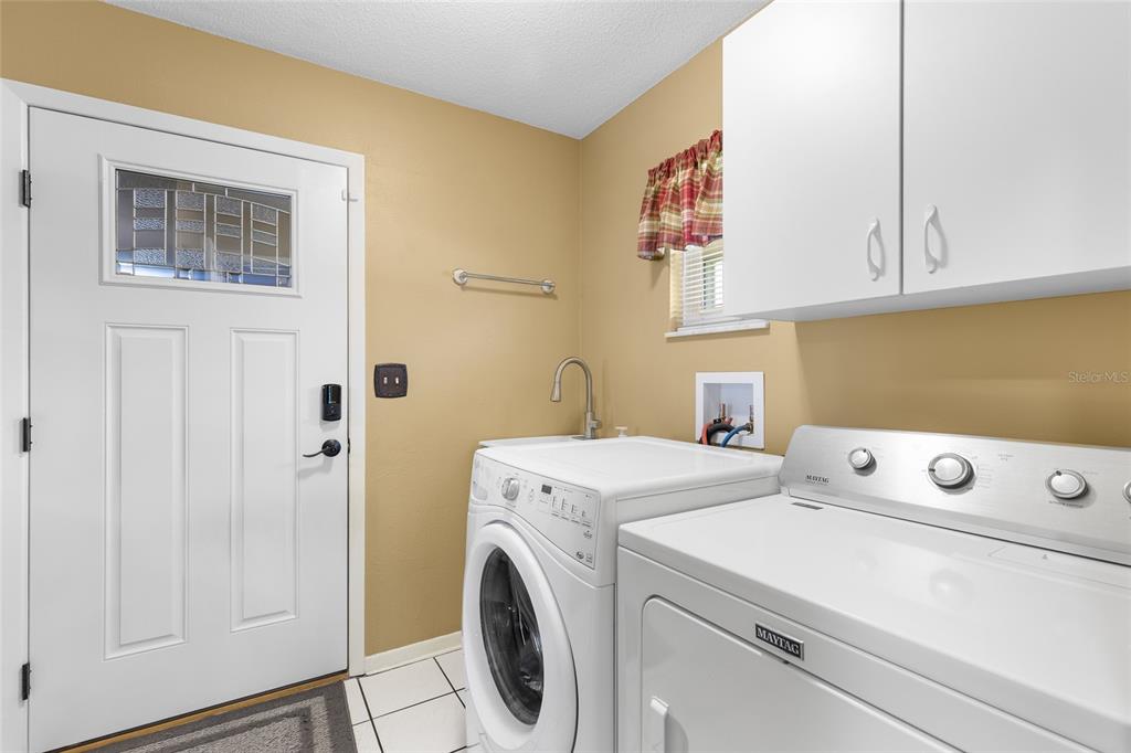 4312 Yorketowne Road Orlando, FL 32812 - Photo 21 of 38 Laundry room with garage access.