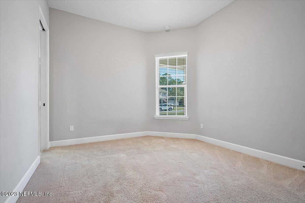 26 Woodview Court Ponte Vedra, FL 32081 - Photo 16 of 71 an empty room with windows