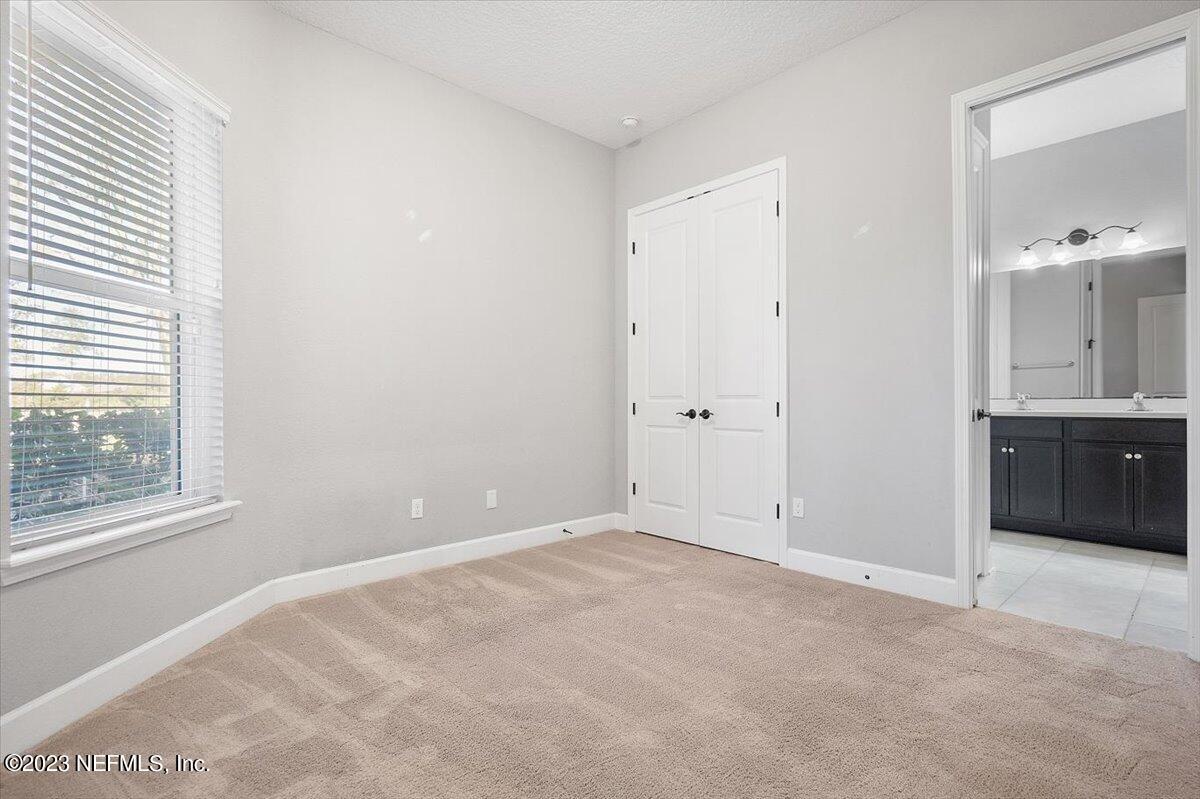 26 Woodview Court Ponte Vedra, FL 32081 - Photo 19 of 71 a view of an empty room with a window