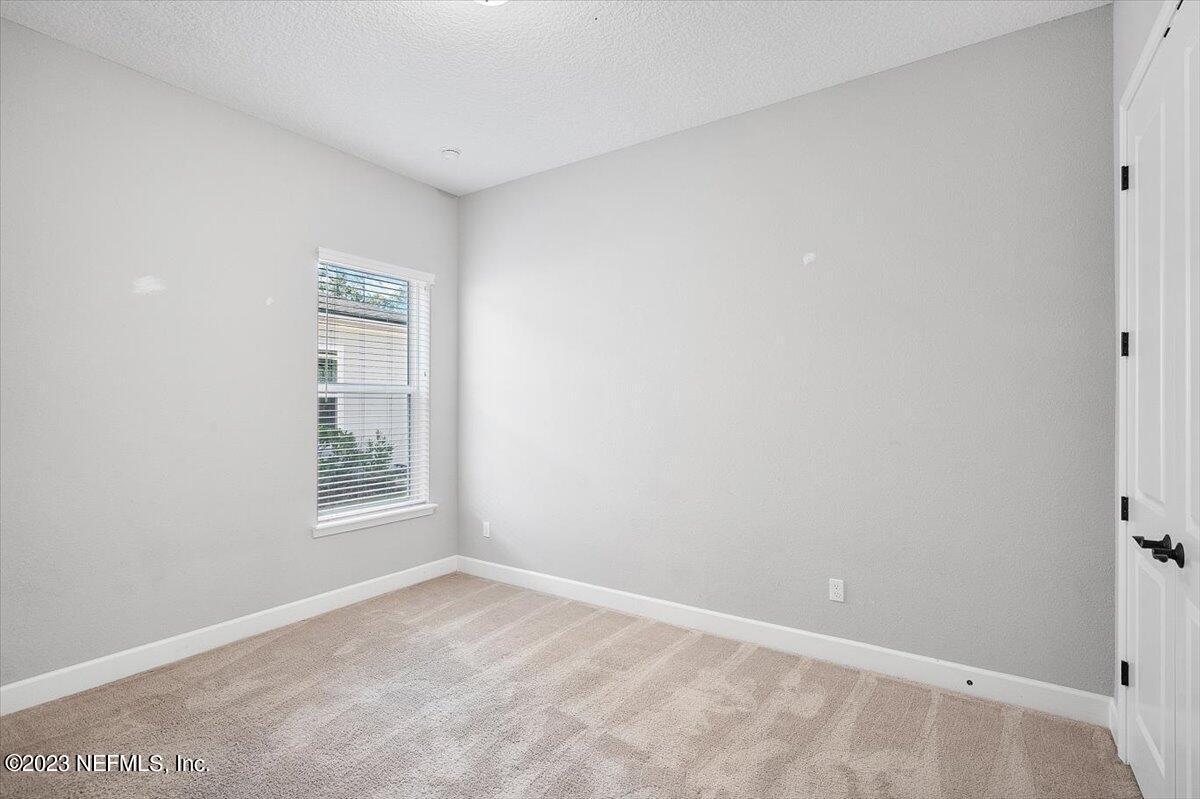 26 Woodview Court Ponte Vedra, FL 32081 - Photo 23 of 71 an empty room with windows and closet