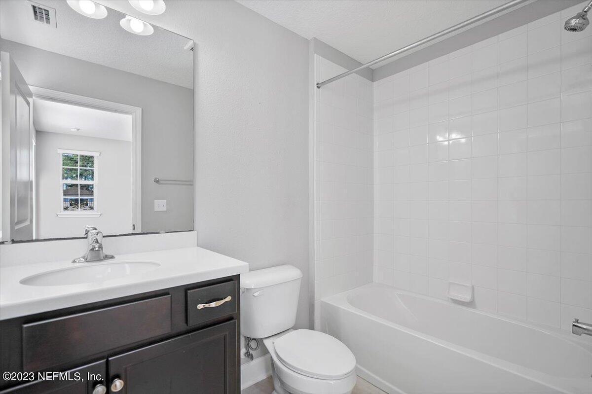 26 Woodview Court Ponte Vedra, FL 32081 - Photo 26 of 71 a bathroom with a sink a toilet and shower