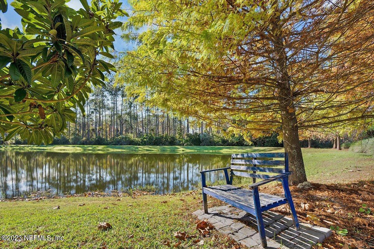 26 Woodview Court Ponte Vedra, FL 32081 - Photo 30 of 71 a view of a lake with sitting area