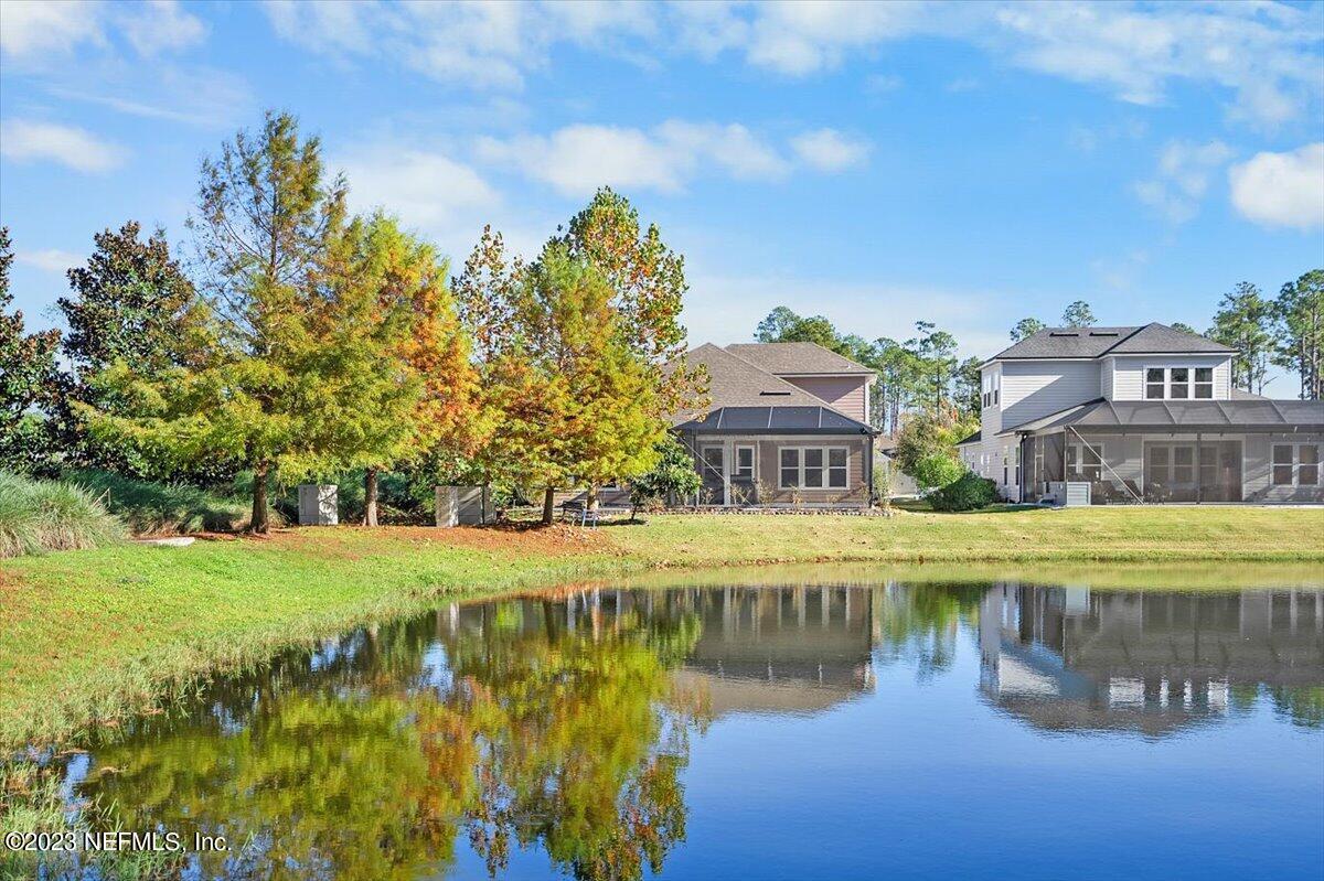 26 Woodview Court Ponte Vedra, FL 32081 - Photo 32 of 71 a view of a lake with a house in the background