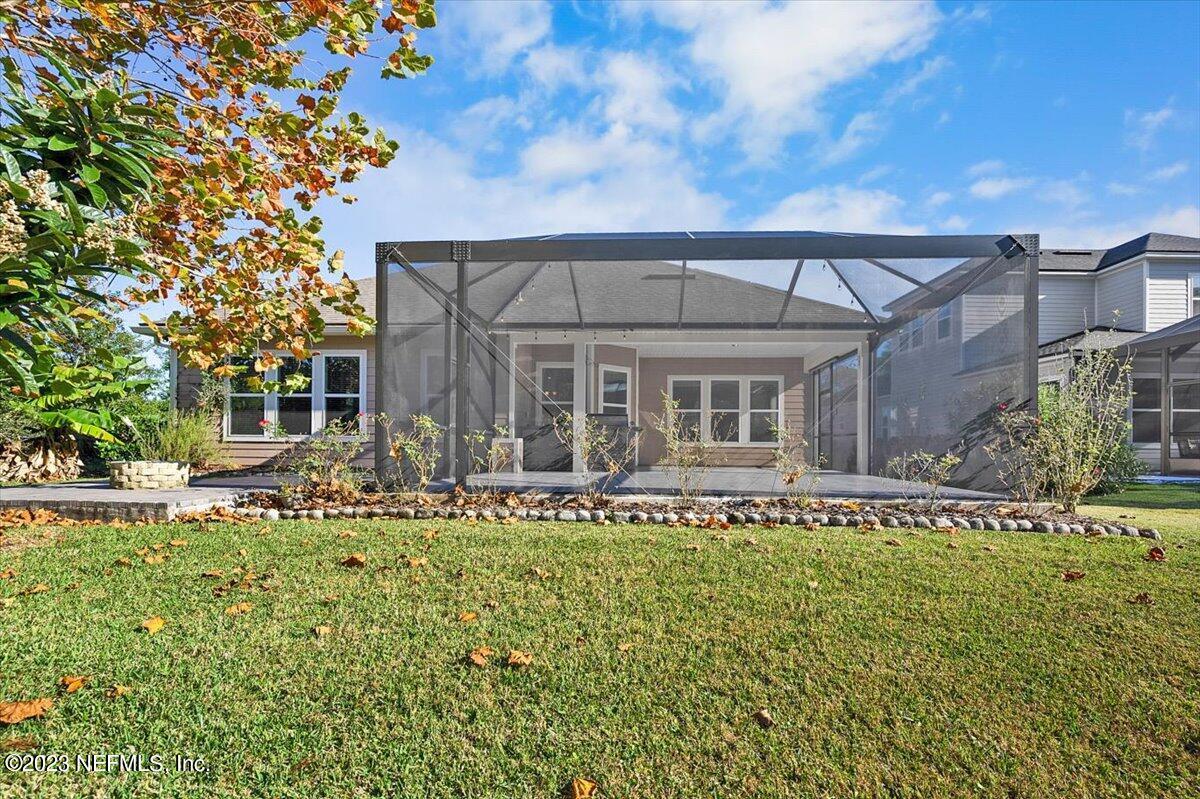 26 Woodview Court Ponte Vedra, FL 32081 - Photo 33 of 71 a front view of a house with a garden