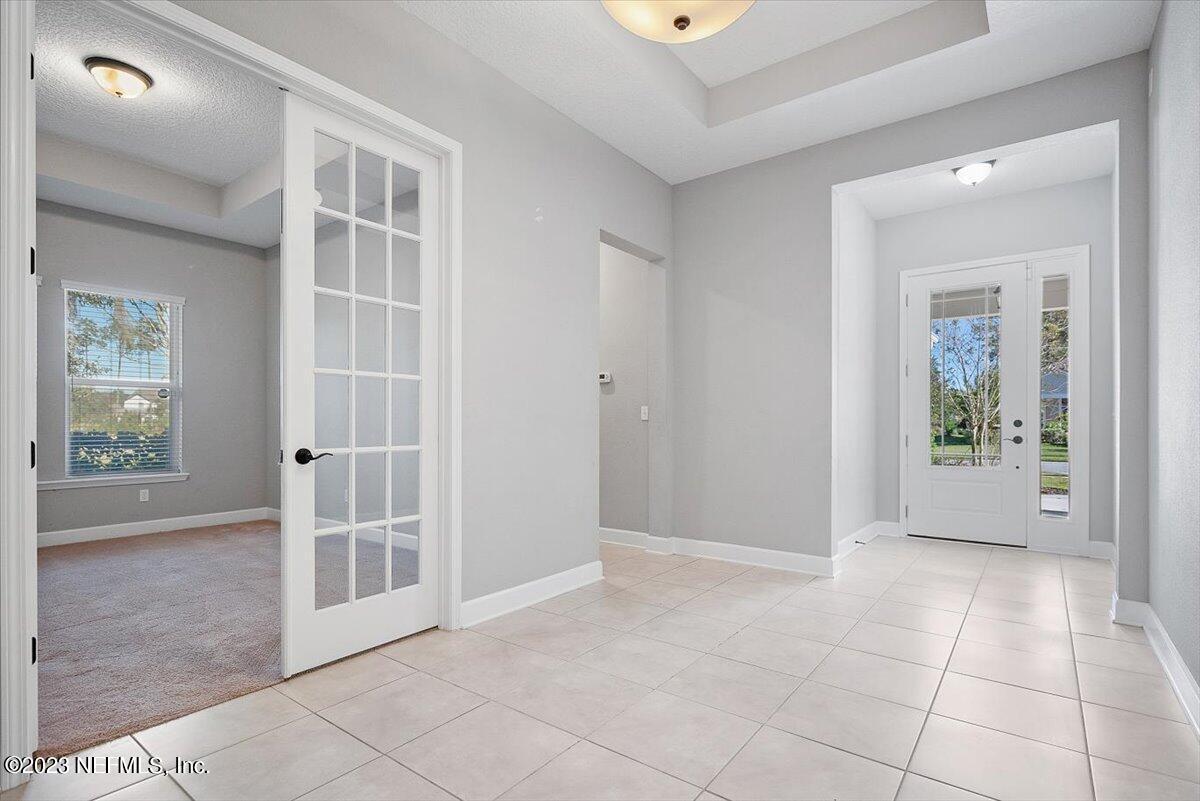 26 Woodview Court Ponte Vedra, FL 32081 - Photo 4 of 71 an empty room with windows and outdoor view