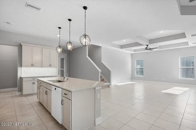 a view of an empty room with windows