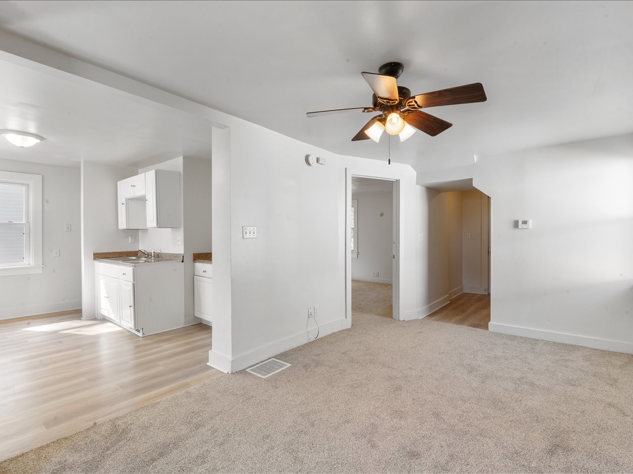 1186 24th Street Moline, IL 61265 - Photo 12 of 27 a view of a kitchen with wooden cabinet and a window