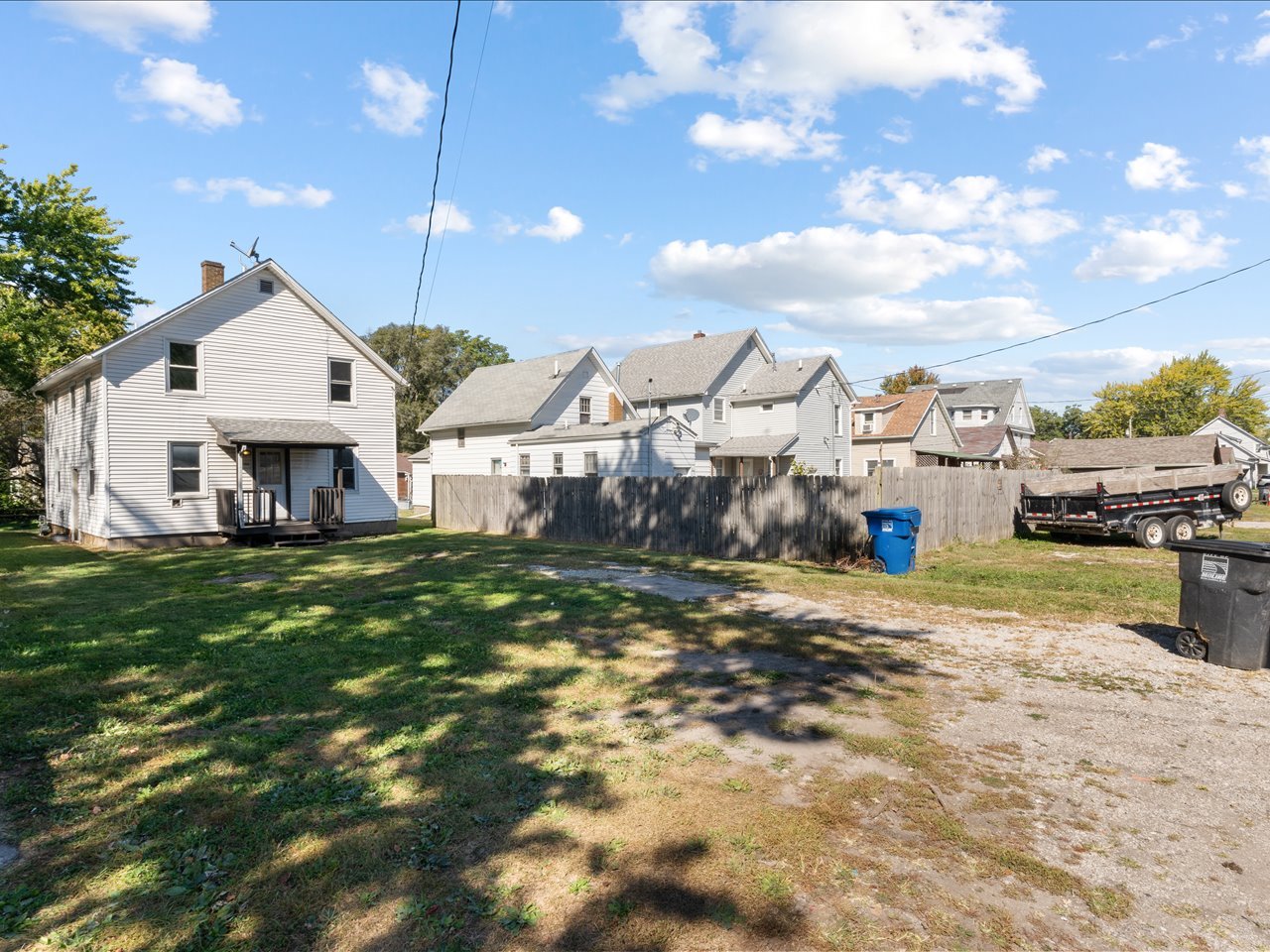 1186 24th Street Moline, IL 61265 - Photo 7 of 27 a front view of a house with a yard and garage