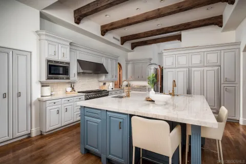 a kitchen with granite countertop a sink and wooden cabinets