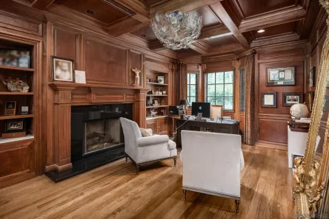 a kitchen with stainless steel appliances granite countertop a stove and white cabinets next to a window