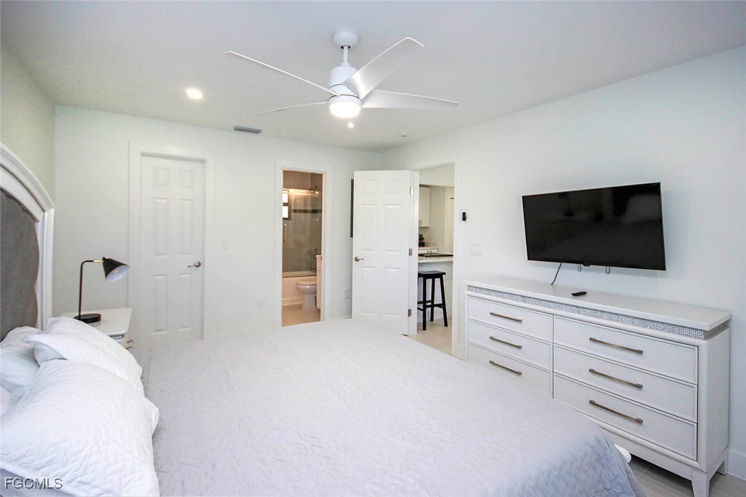 5117 Sea Bell Road, Unit E103 Sanibel, FL 33957 - Photo 13 of 24 a hotel room with a flat screen tv on dresser and a flat screen tv