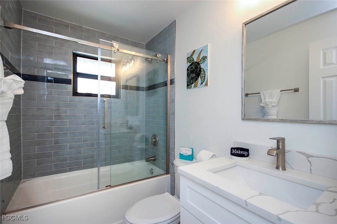 5117 Sea Bell Road, Unit E103 Sanibel, FL 33957 - Photo 14 of 24 a bathroom with a sink and a mirror