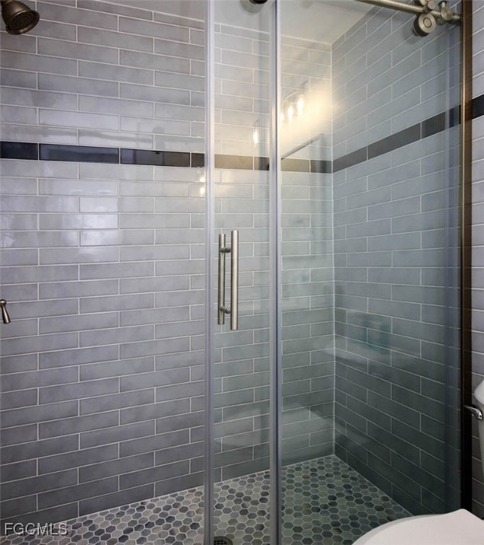 5117 Sea Bell Road, Unit E103 Sanibel, FL 33957 - Photo 18 of 24 a bathroom with a shower