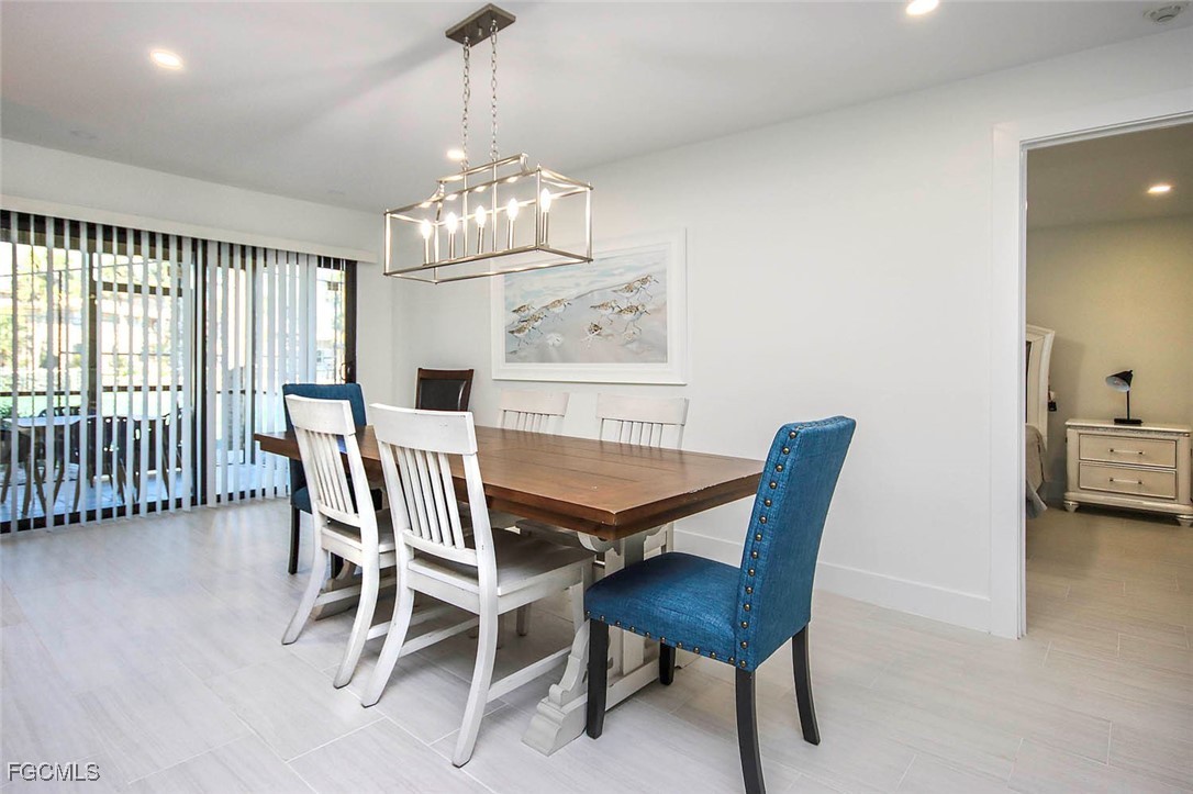 5117 Sea Bell Road, Unit E103 Sanibel, FL 33957 - Photo 5 of 24 a view of a dining room with furniture window and outside view