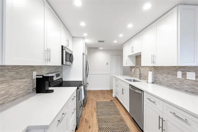 a view of a dining room kitchen furniture and a chandelier