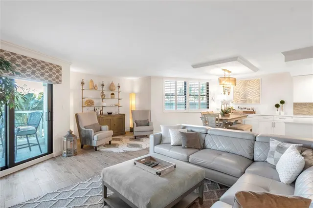 a bathroom with a granite countertop sink toilet a large mirror a shower and a mirror