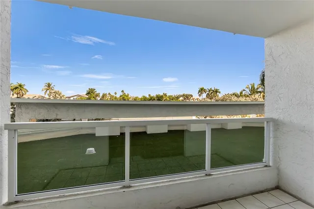 a living room with two mirror and a window