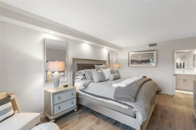 a bedroom with bed and a large window