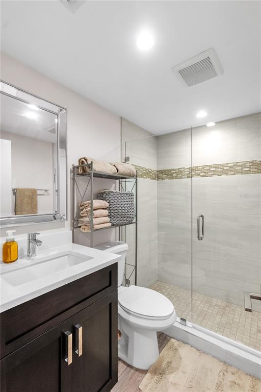 1000 Longboat Club Road, Unit 204 Longboat Key, FL 34228 - Photo 35 of 66 a bathroom with a sink a toilet and shower