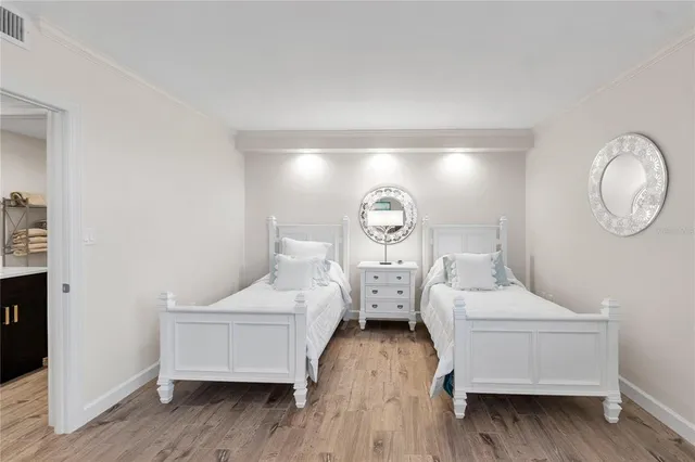 a living room with furniture and floor to ceiling windows