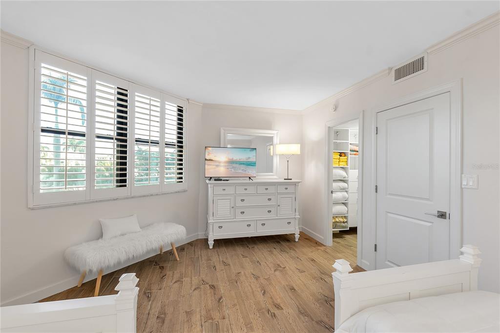 1000 Longboat Club Road, Unit 204 Longboat Key, FL 34228 - Photo 39 of 66 a view of a bedroom with furniture and windows