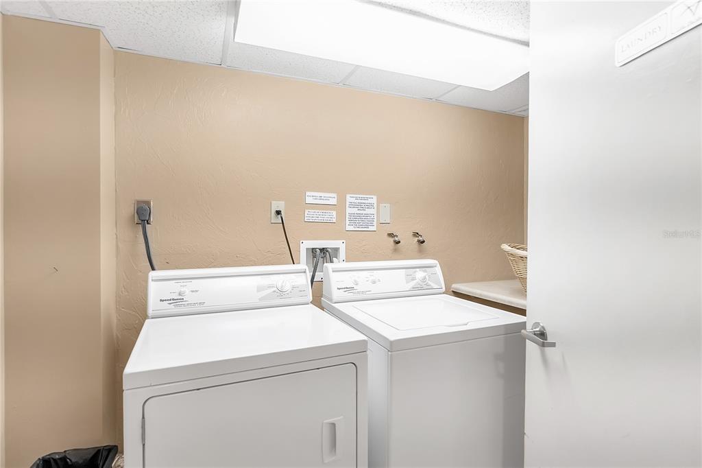 1000 Longboat Club Road, Unit 204 Longboat Key, FL 34228 - Photo 41 of 66 a utility room with dryer and washer