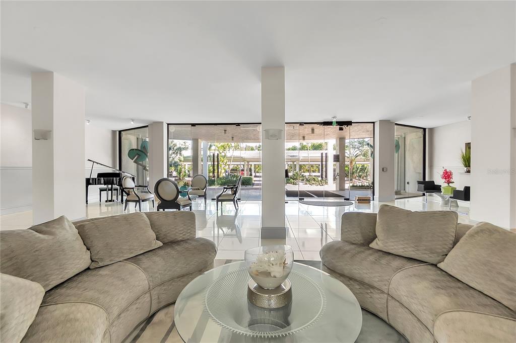 1000 Longboat Club Road, Unit 204 Longboat Key, FL 34228 - Photo 43 of 66 a living room with furniture and a large window