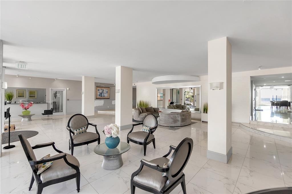 1000 Longboat Club Road, Unit 204 Longboat Key, FL 34228 - Photo 44 of 66 a view of a dining room with furniture and a chandelier