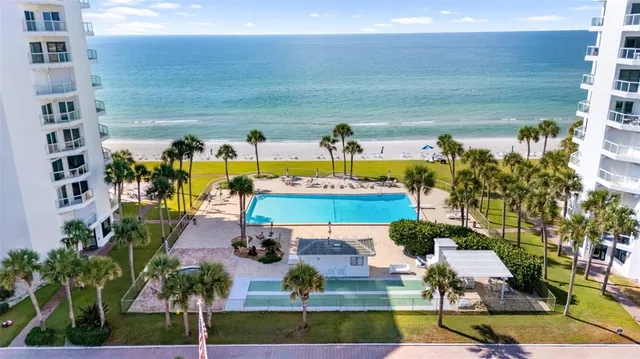 a view of a living room with furniture and wooden floor