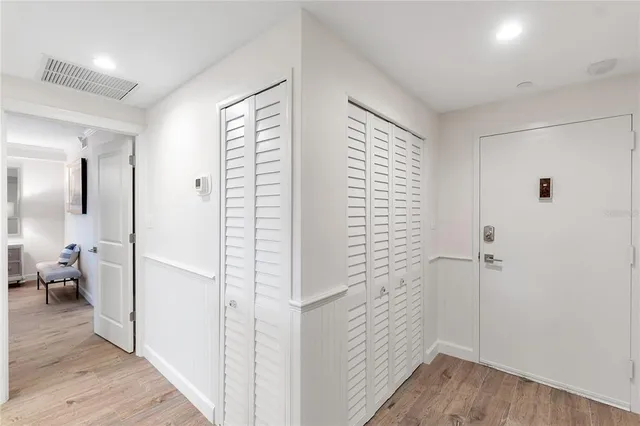 a kitchen with granite countertop a refrigerator and a sink