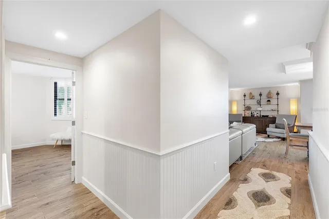a kitchen with a sink a stove top oven and white cabinets