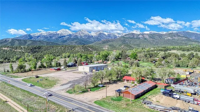 a view of a backyard with sitting area