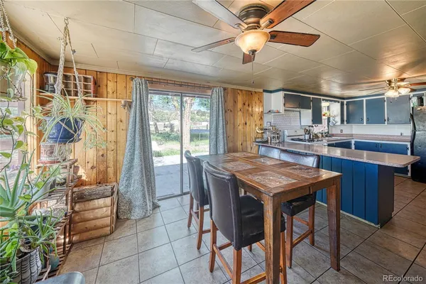 a kitchen with a table and chairs in it