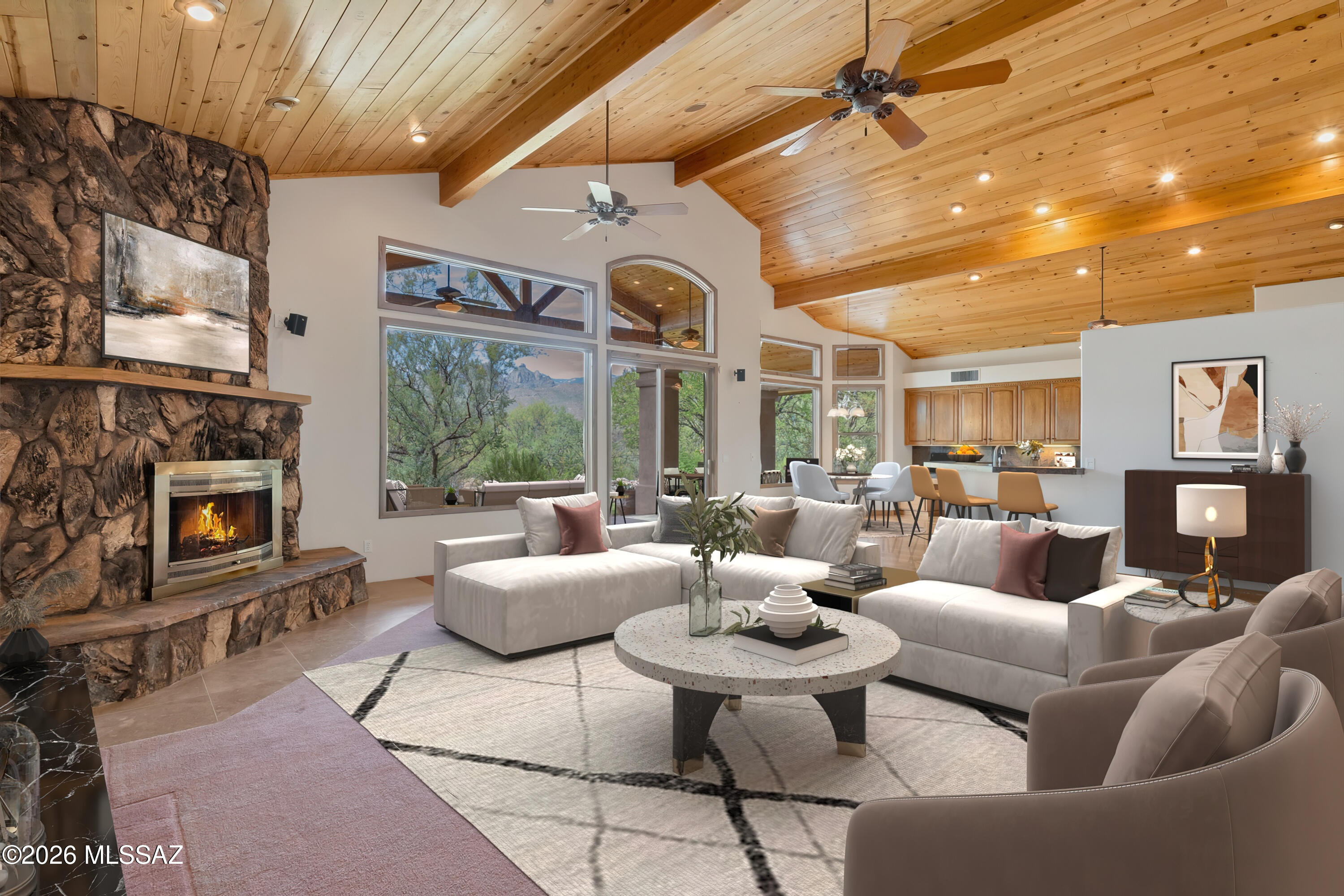 4001 North Harrison Road Tucson, AZ 85749 - Photo 9 of 50 a living room with furniture a fireplace and a ceiling fan