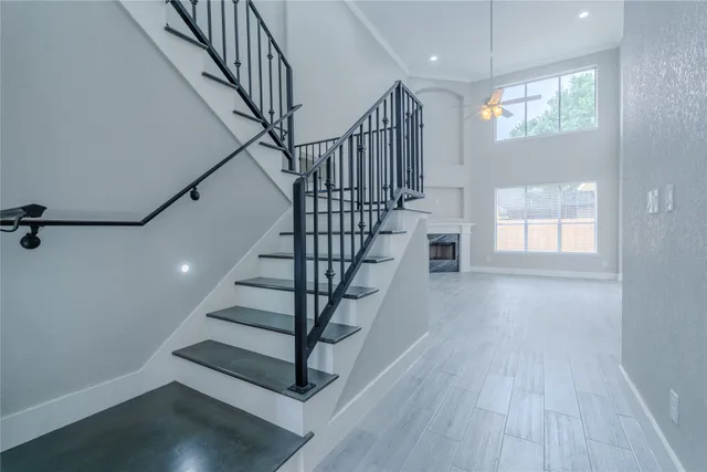 a view of entryway with wooden floor and stairs
