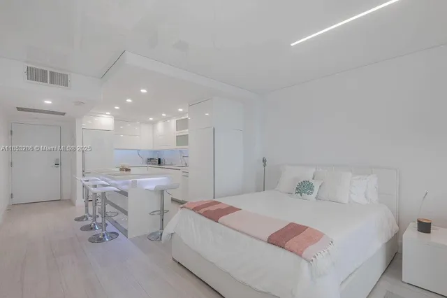 a bathroom with a sink a toilet and a shower