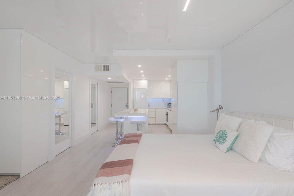 2301 Collins Avenue, Unit 811 Miami Beach, FL 33139 - Photo 15 of 42 a bathroom with a sink a toilet and a shower